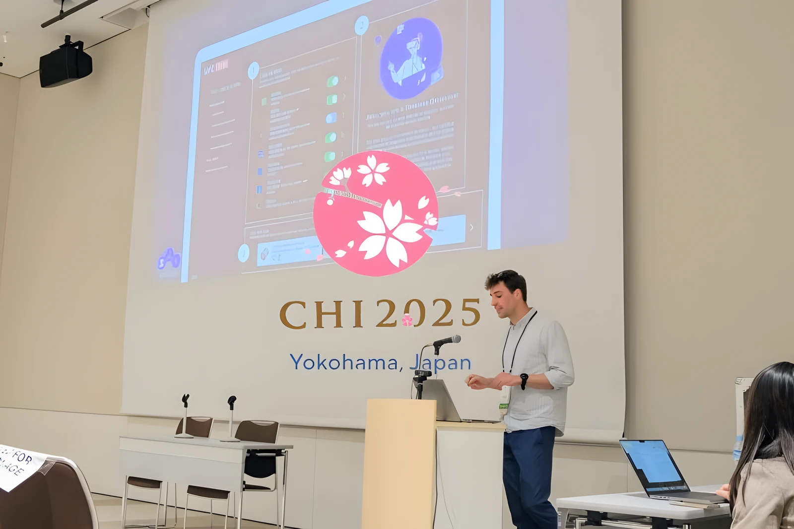 Presenting the study at CHI 2025 in Yokohama: the data profile screen projected beside the conference title slide.